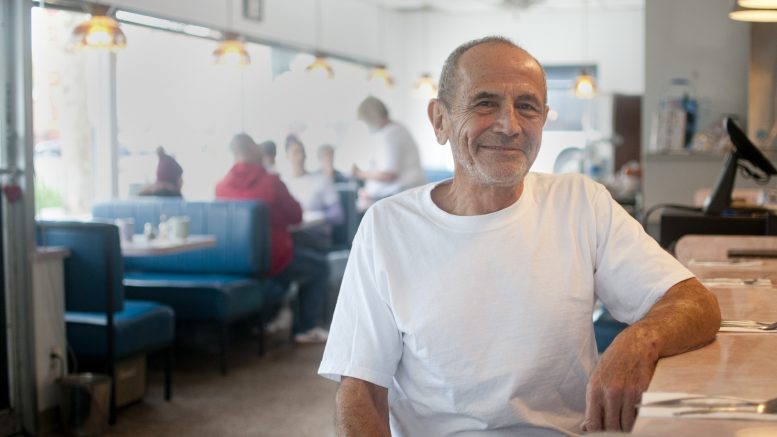 John Fierro, owner of Lil Joe's, sits at the restaurant's counter.
