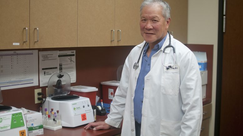 Dr. Douglas Young with medical testing equipment
