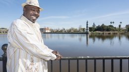 Larry Jackson standing next to Delta waterfront