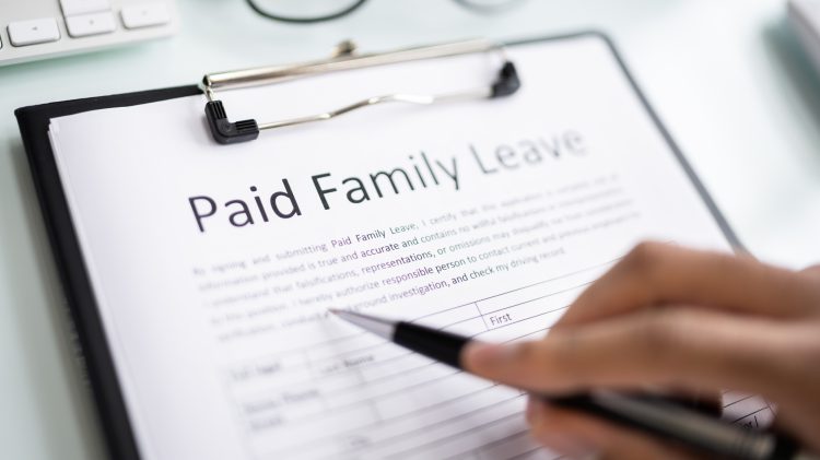 Image for display with article titled Paid family leave helps women keep jobs