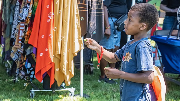 Image for display with article titled Photo essay: ‘It’s a family thing’ – Sacramento’s Juneteenth celebration brings the energy to Land Park