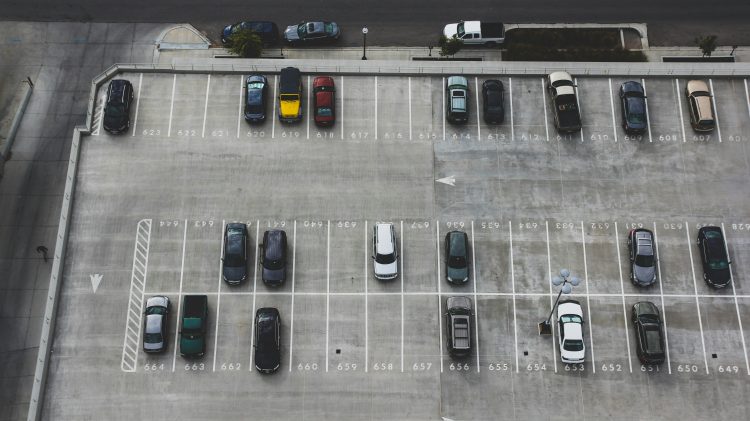 Image for display with article titled One solution to fight climate change? Fewer parking spaces