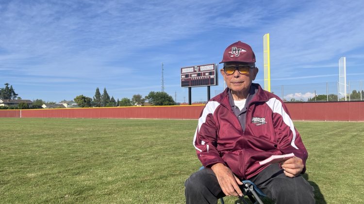 Image for display with article titled He Learned Baseball During a Grim Chapter in Local History – Now He’s Still Coaching the Game at Age 92