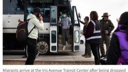 Migrants arrive at the Iris Avenue Transit Center