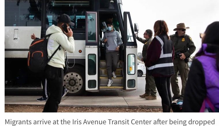 Migrants arrive at the Iris Avenue Transit Center