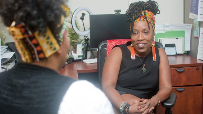 LaDonna Lee in her office with another women