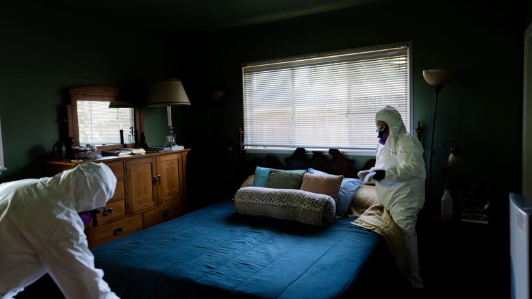 A group of Latin American migrants works to restore a home damaged by the recent wildfires in Los Angeles.
