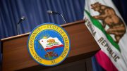Press conference of governor of the state of California concept. Seal of the governor of the State of California on the tribune with flag of USA and California state. 3d illustration